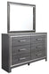 Lodanna King Panel Bed with 2 Storage Drawers with Mirrored Dresser, Chest and Nightstand